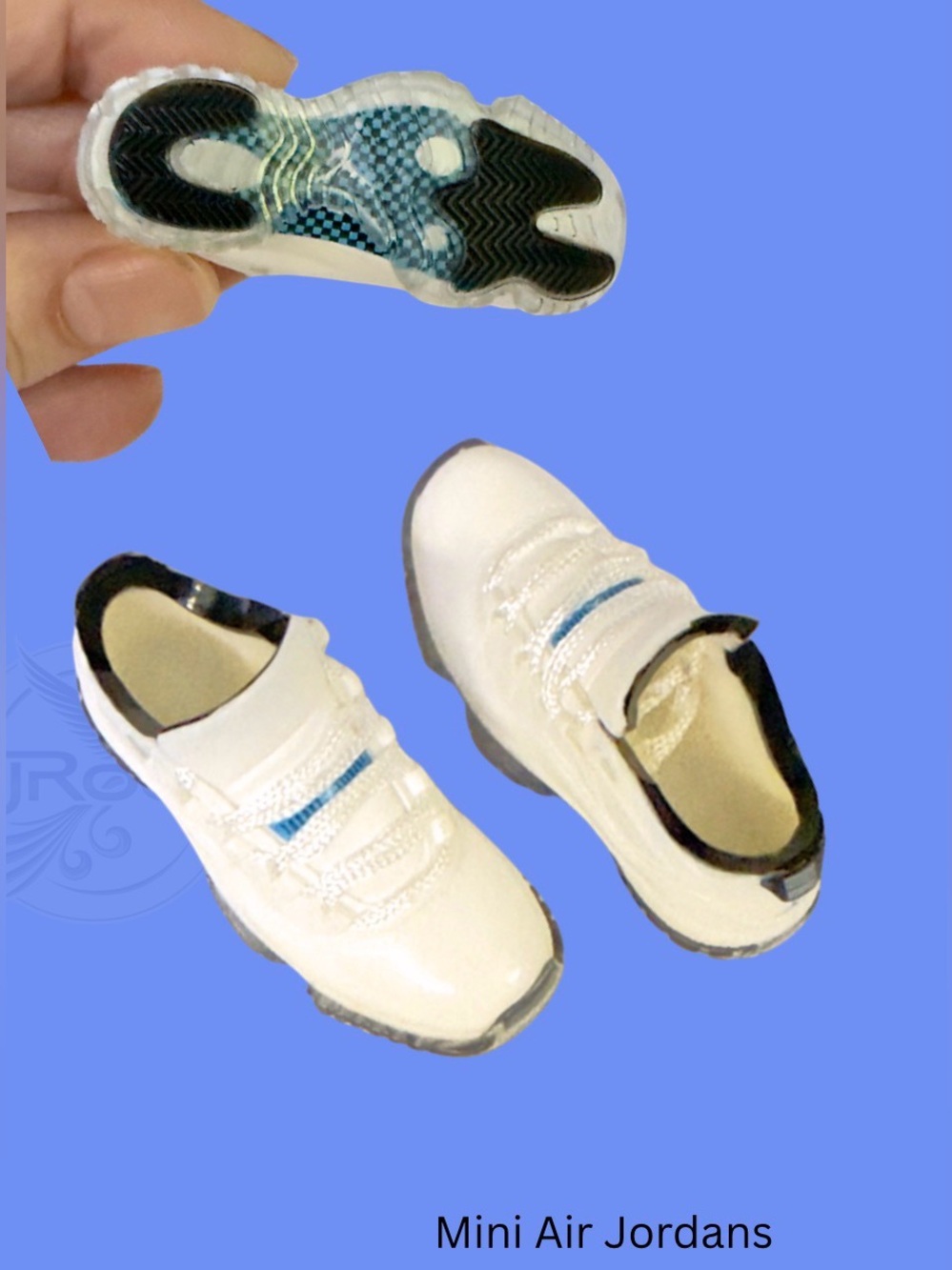 Mini White Athletic Sneakers with Blue Trim. Comes with miniature clear box.